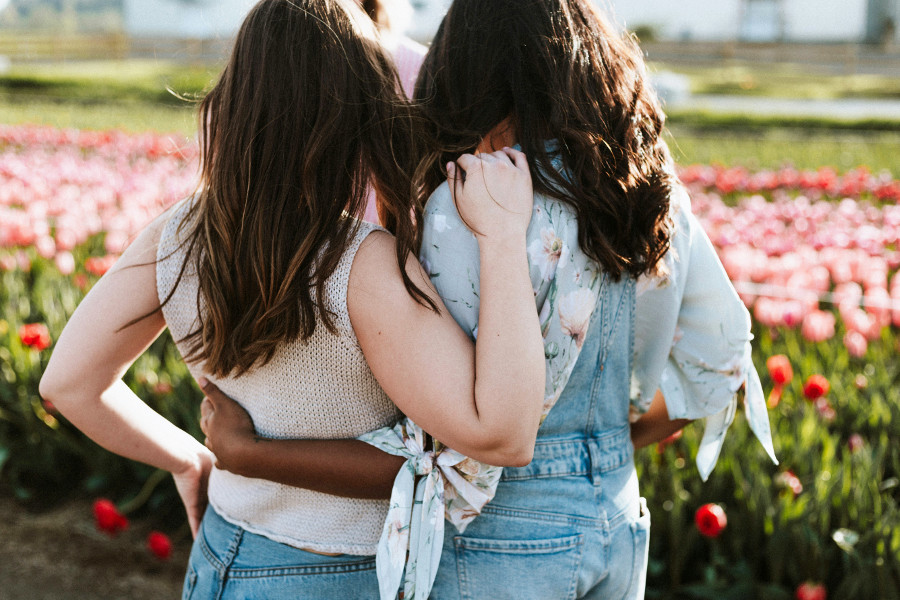 improve your emotional intelligence (EQ) - friends hugging
